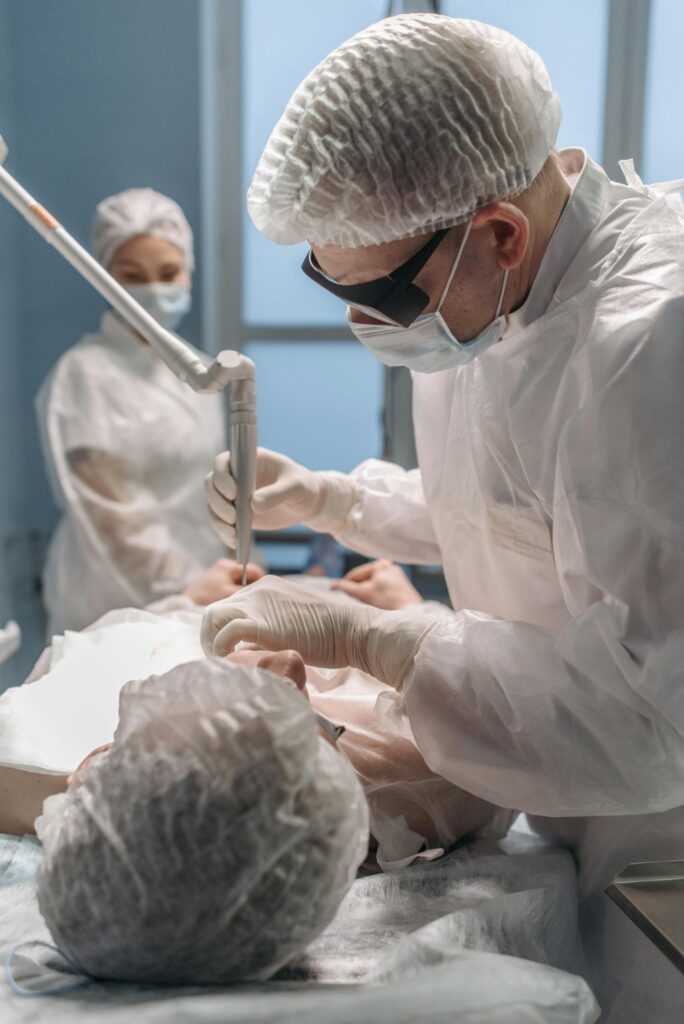 Medical professionals conducting surgery with precision in a sterile operating room.